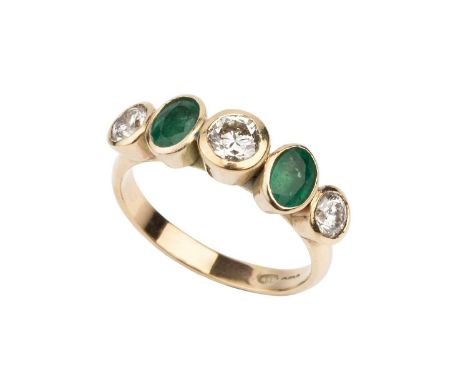 An emerald and diamond five stone ring, alternately set with round brilliant-cut diamonds and oval mixed-cut emeralds in coll