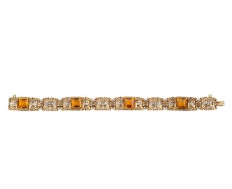 A citrine and diamond bracelet, designed as a series of openwork scrolled panels, alternately set with square step-cut citrin