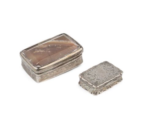 A mid Victorian silver vinaigrette, of shaped rectangular form, engraved with scrolling foliage and having scroll pierced hin