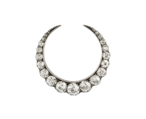 A late 19th/early 20th century diamond crescent brooch/pendant, designed as a row of graduated old brilliant-cut diamonds in 