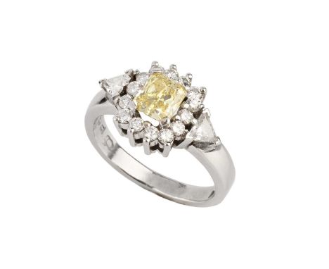 A diamond cluster ring, centred with a radiant-cut diamond of yellow tint (untested for natural colour), framed by round bril