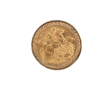 A sovereign ring, the Edward VII sovereign dated 1909, loose mounted to a 9ct gold ring mount with scroll pierced gallery and