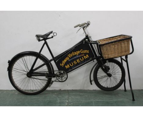 *  Gundle a vintage shop bike with basket to front and sign written for Solway Vintage Guns Museum, established 1987, the opp