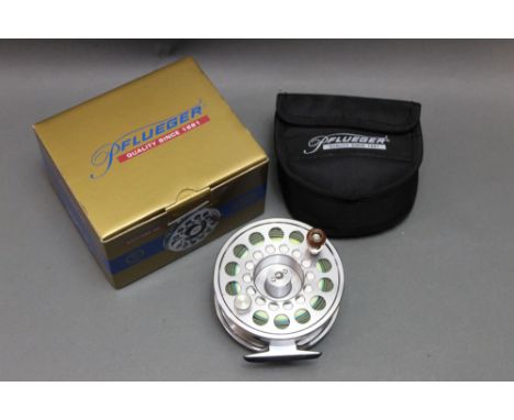 A Pflueger Trion salmon fly reel, with box and pouch, model No. 1912.