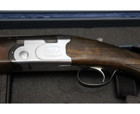 Beretta a model S685E over/under shotgun, with 27 3/4" barrels, 70 mm chambers, ejector, top lever, automatic selective safet