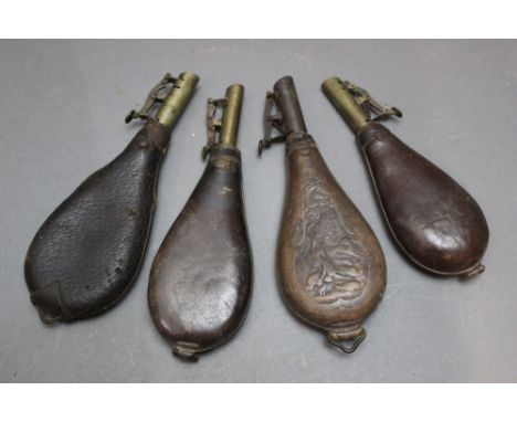 *  G &amp; J.W. Hawksley, an embossed leather bodied shot flask, embossed with hanging game 21 cm, together with three other 