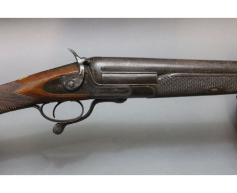 An English single barrel 10 bore hammer shotgun, with a 34" barrel, rotary underlever.  NOTE:  This gun dates from around 189