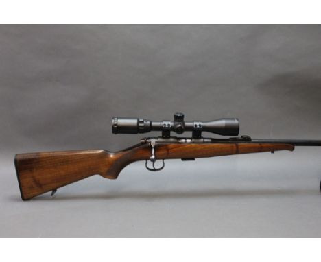 A Brno model 2 cal 22 LR bolt action rifle, fitted with a sound moderator and an AGS 3-9 x 40 telescopic and a AGS 3-9 x 40 t