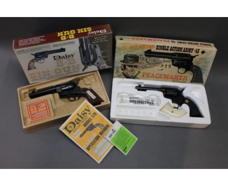 A Daisy model 179 cal 177 BB air pistol, together with another Serial L185395.  WE CANNOT POST AIR GUNS TO PRIVATE ADDRESSES.