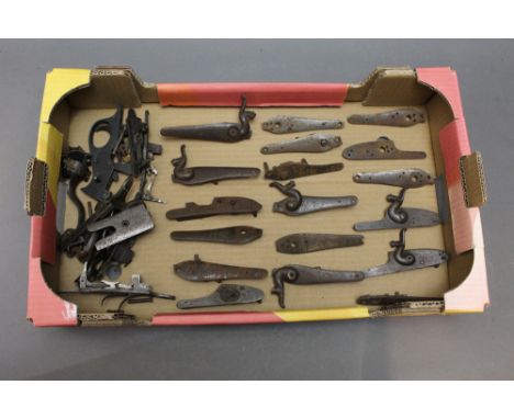*  A collection of unnamed shotgun lock plates, some with hammers, together with Rotary under levers, triggers etc.