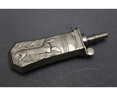 *  A silver coloured pistol powder flask, decorated with a mythical beast, 10 cm.