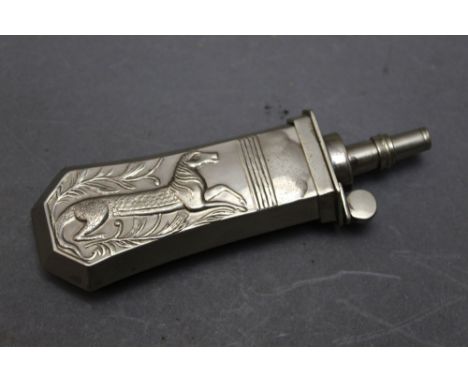 *  A silver coloured pistol powder flask, decorated with a mythical beast, 10 cm.