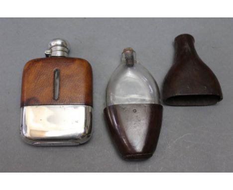 *  Two hip flasks, the first by Dispatch marked 8oz with a silver plated bottom and leather top, together with an earlier lea