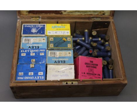Three hundred + 16 bore shotgun cartridges, to include Eley etc. together with a wooden cartridge magazine. SHOTGUN CERTIFICA