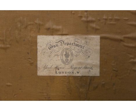 *  A canvas and leather trimmed cartridge magazine, opening to a segmented interior with trade label to the lid, Gun Departme