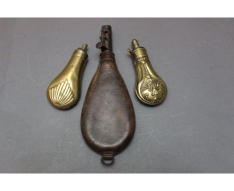 *  G &amp; J.W. Hawksley an embossed pistol powder flask, length 12 cm, together with one of fluted design 12 cm and a leathe