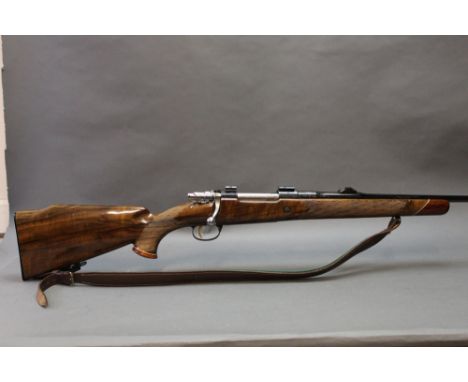 A Browning cal 308 bolt action rifle (possibly a Medallion Deluxe model) with engraving to the breech end, with a high grade 