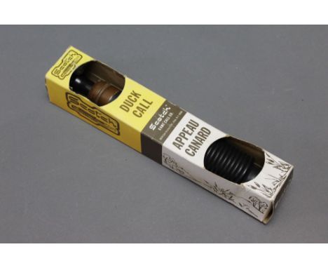 A Scotch duck call, in original box.