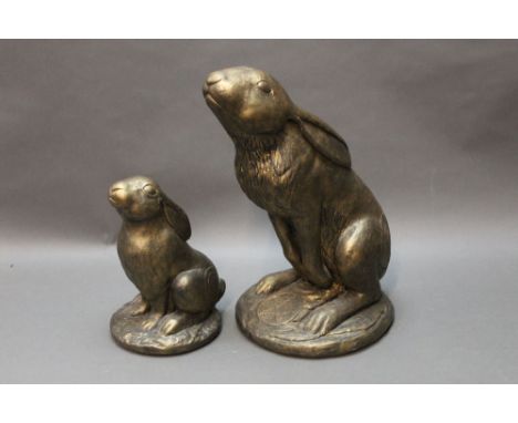 Two garden sculptures of hares, by Tony Firks, the first Model No. 1208 "Eclipse" and another 478 "Moon Gazing Hare".  Height