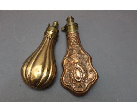 *  G &amp; J.W. Hawksley Sheffield a heavily embossed powder flask, length 21 cm, together with a fluted bodied flask 19 cm.