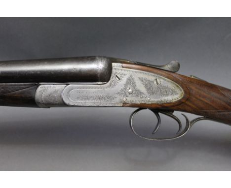 An Army & Navy 16 bore side by side shotgun, with 28" barrels, cylinder and cylinder choke, 2 1/2" chambers, side lock, non e