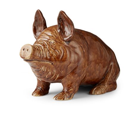 A LARGE WEMYSS WARE PIG  CIRCA 1900   covered in a brown glaze, impressed mark WEMYSS WARE/ R. H. & S., retailer's label for 