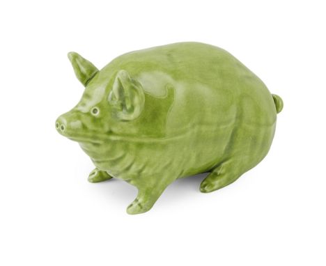 A SMALL WEMYSS WARE PIG  CIRCA 1900   covered in a green glaze, impressed mark WEMYSS WARE / R. H. & S.  16.5cm long