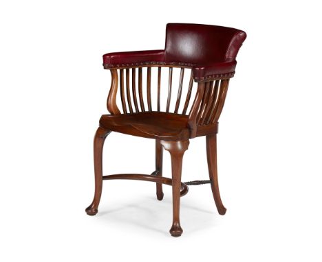 A SCOTTISH OAK FRAMED DESK CHAIR BY FRANCIS SMITH, GLASGOW  CIRCA 1890   the leather-upholstered back and arms above curved s