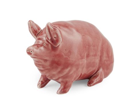 A SMALL WEMYSS WARE PIG  CIRCA 1900   covered in a puce glaze, impressed maker's mark WEMYSS WARE / R. H. & S.  16.5cm long