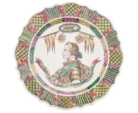 A SCARCE STAFFORDSHIRE JACOBITE COMMEMORATIVE PLATE  18TH CENTURY   of shaped circular outline, moulded rim and low relief la