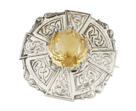 A CITRINE SET PLAID BROOCH  R W FORSYTH, EDINBURGH 1929   of shaped circular outline with Celtic scroll borders, with eight a