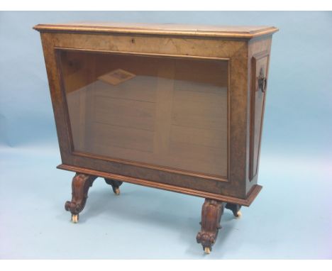 An unusual Victorian burr walnut artist's cabinet, rectangular tapering form with hinged top, glazed front, panelled obverse,