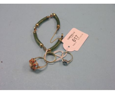 An 18ct. gold ring, set two diamond chips and three sapphires, a 14ct. gold ring set opal and coral stones, a 9ct. white gold