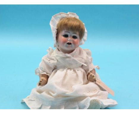 A German bisque doll, Max Handwerck, Bebe Elite, mould 90/185 with sleeping eyes and open mouth, bent-limb composition body, 