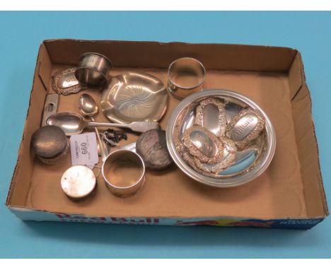 A set of five embossed silver wine labels, Birmingham 1982, two silver dishes, three silver napkin rings, engine-turned silve