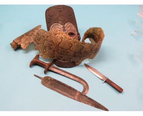 A wrought metal hunting spear-head, 14in., two wood-handled knives, carved wood tribal mask and a snake-skin  Shipping arrang