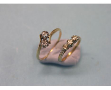 Two 18ct. gold and diamond rings, three-stone half-hoop, size K, two-stone old-cut crossover, size U/V 