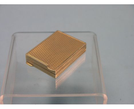 An engine-turned 9ct. gold compact, 51.1 grams gross total 