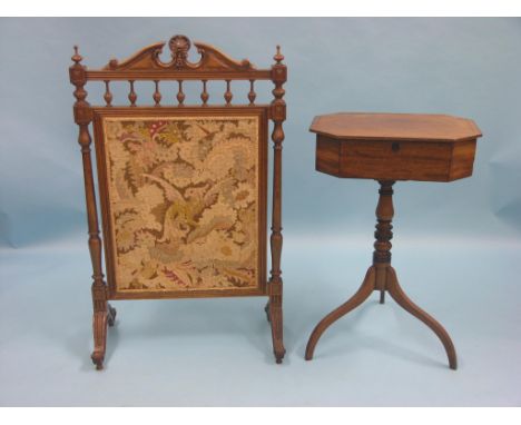 A Victorian walnut firescreen, carved architectural detail with inset needlework panel, together with a Victorian mahogany wo
