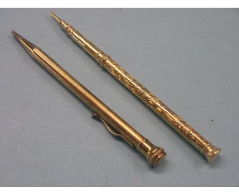 An engine-turned 9ct. gold ever-pointed pencil, and a Mordan & Co. engraved yellow metal ever-pointed pencil