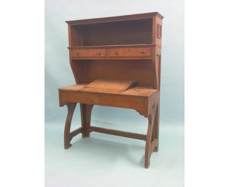 A Victorian Arts & Crafts solid walnut library desk, unusual form consisting of open shelf and two drawers raised above hinge