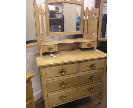A late Victorian satin-beech dressing chest, adjustable mirrors above two trinket drawers, two short and two long drawers ben