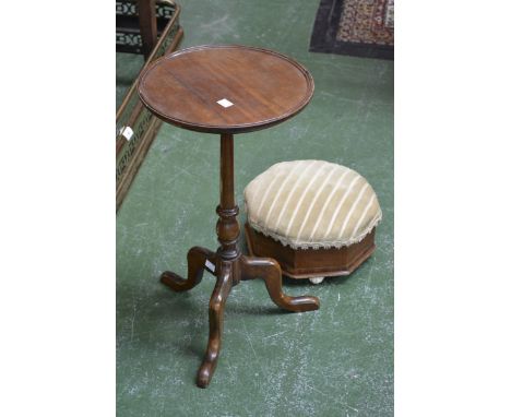 A fruitwood circular pedestal tripod wine table, the circular dished top supported on a turned column with three cabriole leg