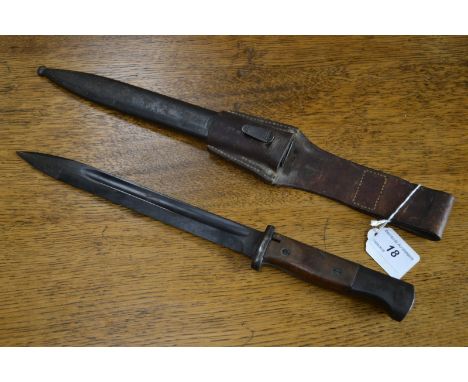 A German bayonet and scabbard with leather frog, marked 8853-45ASW