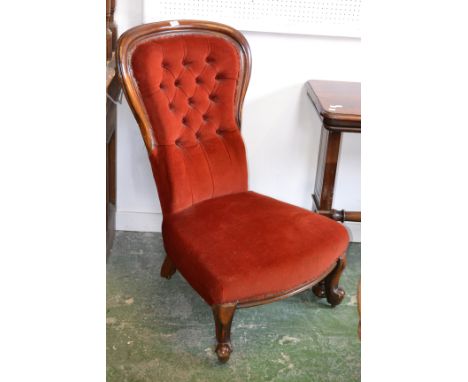 A Victorian mahogany balloon back chair with button back turned legs c.1880.