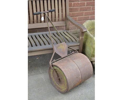 A cast iron garden roller.
