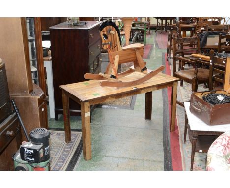 A 20th century pine sitting room table; a child's pine rocking horse. (2)