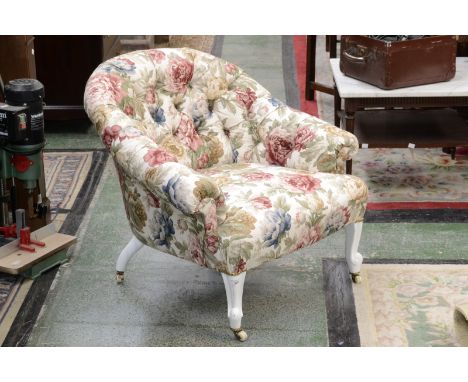 A Victorian button back tub chair, stuffed overseat, French cabriole forelegs, ceramic casters.
