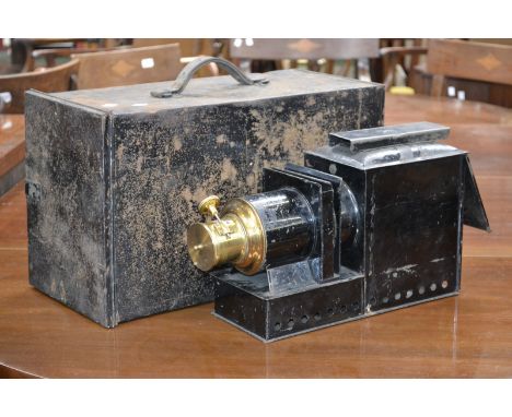 A magic lantern in metal case.