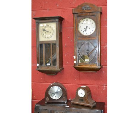 A 1920s oak wall clock; another similar; an early 20th century oak Westminster chime mantel clock; another similar  (4)